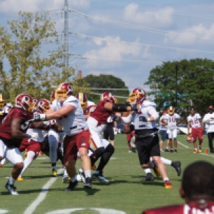 The offensive and defensive lines go at it during drills. (Photo by Jake Russell)