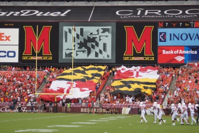 Fans display the Maryland state flag in the west end zone of FedEx Field. (Photo by Jake Russell)